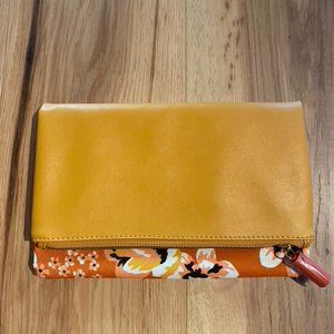 NWOT. Reversible -Yellow Vegan Leather and Floral Clutch by Rachel Pally